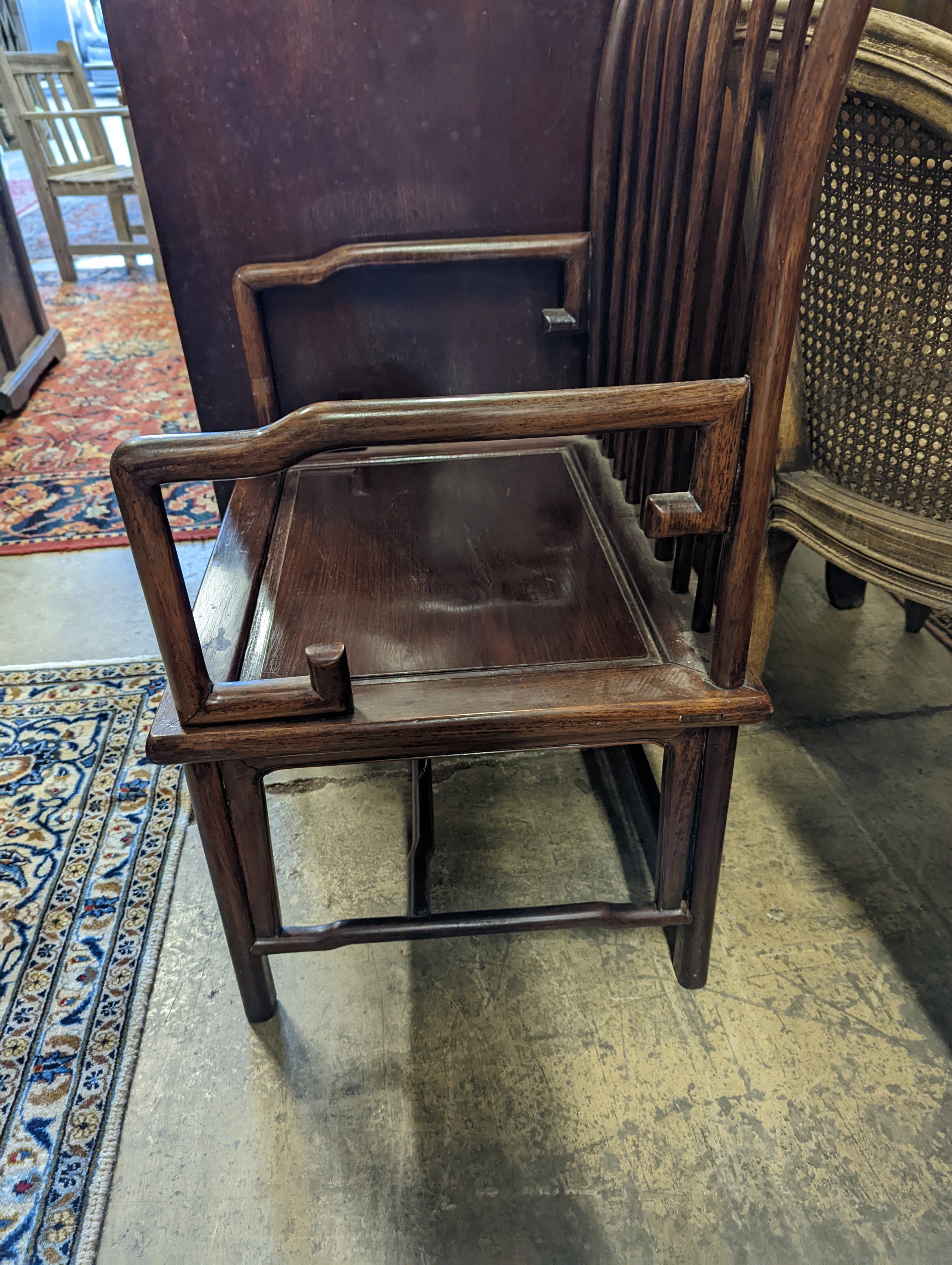 A pair of mid 20th century Chinese Hongmu elbow chairs with cushion seats, width 58cm, depth 49cm, height 92cm